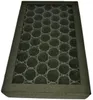 A close-up, angled view of an air filter with a black frame and a grid of circular carbon filters inside. Náhľad obrázku produktu