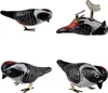 Four tin toys shaped like woodpeckers, arranged in a grid. Produktbild-Vorschau