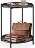A two-tiered round side table with items on each tier. Produktbild-Vorschau