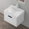 A white vanity sink with a black handle set against a gray wall and wooden floor. Anteprima dell’immagine prodotto