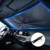 Interior of a car with a sunshade umbrella deployed on the windshield. Produktbild-Vorschau