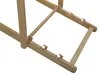 A close-up view of the wooden frame of a lounge chair, showing the joints and some copper-colored clips. Náhled obrázku produktu