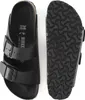 A top-down view of a pair of black Birkenstock Arizona sandals, one showing the sole and the other the footbed. Produktbild-Vorschau