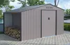 A metal garden shed with an attached wood storage area, set on a paved patio with trees and a pool in the background. Produktbild-Vorschau