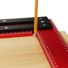 A close-up view of a woodworking tool with a pencil marking a line on a wooden surface. Podgląd zdjęcia produktu