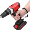 A hand holding a red and black cordless drill with a black wrist strap attached. Náhled obrázku produktu