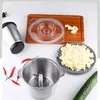 A collection of kitchen tools and ingredients laid out on a white surface. Produktbild-Vorschau