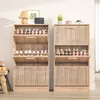 Two wooden shoe cabinets are shown side-by-side in a room. Voir les images du produit