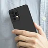 A hand holding a black smartphone case. Produktbild-Vorschau