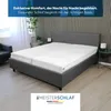 A bed with a mattress topper in a bedroom setting. Produktbild-Vorschau