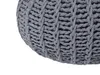 Close-up view of a grey knitted pouf. Náhled obrázku produktu
