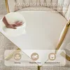 Close-up of a beige velvet chair with gold accents, highlighting its texture and comfort features. Produktbild-Vorschau