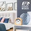 A bedroom scene with a bed and a nightstand featuring an alarm clock and a vase. Produktbild-Vorschau