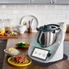 A kitchen counter with a food processor and prepared food. Produktbild-Vorschau