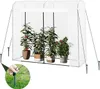 A greenhouse with tomato plants inside, anchored to the ground with stakes. Náhľad obrázku produktu