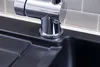 A close-up view of a black kitchen sink with a chrome faucet. Produktbild-Vorschau
