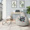A bean bag chair with a snake and skull design is placed in a well-lit room next to a coffee table and a desk. Náhled obrázku produktu