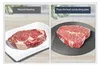 A split image showing two steaks, one thawed naturally and the other on a heat conducting plate. Produktbild-Vorschau