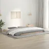A bedroom scene with a low-profile wooden bed frame and bedding. Produktbild-Vorschau