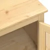 A close-up view of the corner of a wooden cabinet, showing the grain of the wood and the edge of an open door. Podgląd zdjęcia produktu