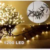 A cluster of warm white LED lights on black wires, with a close-up inset showing the detail of the lights and wires. Produktbild-Vorschau