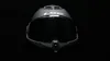 A matte black LS2 motorcycle helmet with a dark visor is shown against a black background. Voir les images du produit