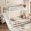 A white wooden bunk bed with a slide and ladder, set up in a room with a window and a rug. Produktbild-Vorschau