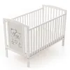 A white baby crib with a mattress inside, shown from a diagonal angle against a white background. Náhľad obrázku produktu