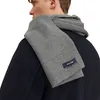A man wearing a dark coat and a gray scarf over his shoulder. Anteprima dell’immagine prodotto