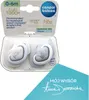 A product package containing two pacifiers, with additional marketing text and a signature on a blue card in the foreground. Produktbild-Vorschau