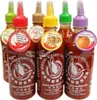 A collection of Flying Goose Sriracha hot chili sauce bottles with different colored caps and labels. Anteprima dell’immagine prodotto