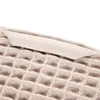 A close-up view of a beige waffle-weave towel. Produktbild-Vorschau