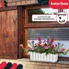 A white planter box filled with colorful flowers sits on a brick windowsill below a wooden-shuttered window. Náhľad obrázku produktu
