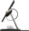 A charging stand for electronic devices, including a phone, smartwatch, and earbuds. Produktbild-Vorschau