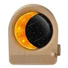 A wooden alarm clock with a moon and stars display. Produktbild-Vorschau
