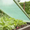 A garden bed with radishes covered by a green net for protection. Produktbild-Vorschau