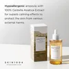 A bottle of serum and its packaging are displayed on a white surface against a white background. Anteprima dell’immagine prodotto