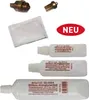A collection of product items, including metal fittings, a packet, and bottles of lubricant, arranged on a white background. Anteprima dell’immagine prodotto