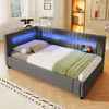 A modern bedroom or living room setting with a grey upholstered bed featuring integrated blue LED lighting. Anteprima dell’immagine prodotto