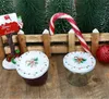 Christmas-themed scene with jars, a mailbox, candy cane, and trees. Podgląd zdjęcia produktu