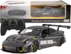 A remote-controlled Porsche 911 GT2 RS Clubsport 25 car and its remote control are displayed with the product packaging in the background. Podgląd zdjęcia produktu