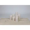 Seven LED candles of varying heights are arranged on a light-colored wooden surface against a plain background. Produktbild-Vorschau