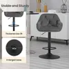 A dark gray bar stool with armrests and a footrest is shown, with close-ups highlighting its features. Náhľad obrázku produktu
