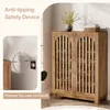 A wooden shoe cabinet with a decorative plant and basket on top, with a close-up inset showing an anti-tipping safety device. Anteprima dell’immagine prodotto