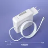 A white laptop charger with a coiled white cable and a silver magnetic connector, set against a light purple background. A measurement line indicates 180cm. Produktbild-Vorschau