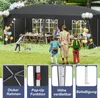 A family is enjoying a party under a black canopy tent in a grassy backyard. Voir les images du produit