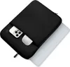 A black laptop sleeve with a phone and a white object in the front pocket, with a laptop partially visible underneath. Náhľad obrázku produktu