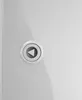 A close-up of a gray button with a play symbol on a white surface. Náhled obrázku produktu