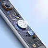 A close-up view of the internal electronic components of a white device, possibly headphones, against a light blue background. Produktbild-Vorschau