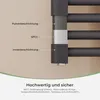 Close-up of a section of a dark gray radiator, highlighting its layered construction and material details with text labels. Produktbild-Vorschau